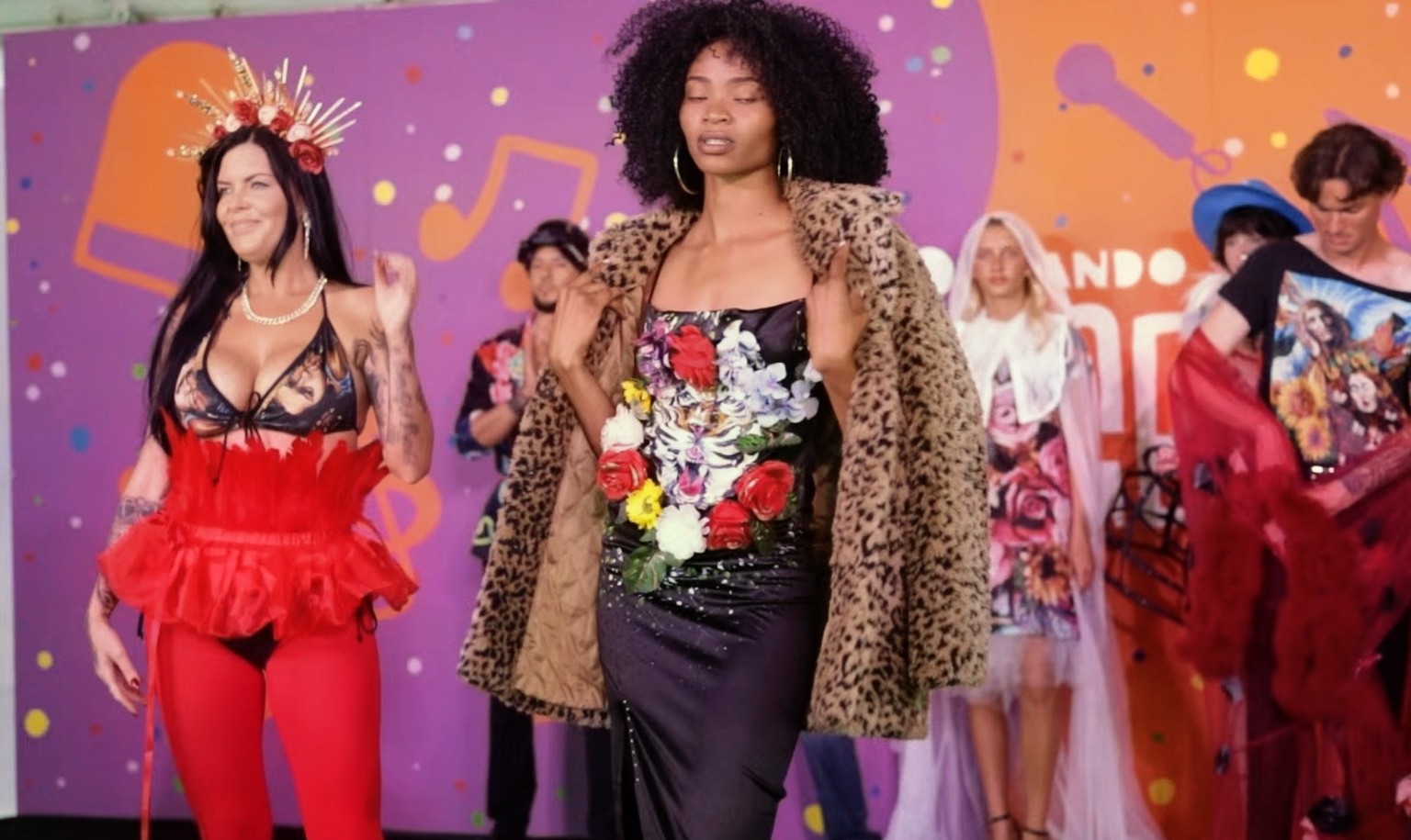 Models presenting avant-garde looks on an Orlando Fringe stage